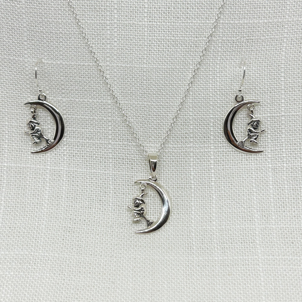 Set in 925 silver, this double sided Witch can be seen flying complete with her hat, astride her broomstick within a crescent moon. She hangs from a hoop so she can move within the moon! This dainty pendant is 2.5cm long including the bale and comes complete on a 925 silver 18 inch chain. Matching drop earrings are also available