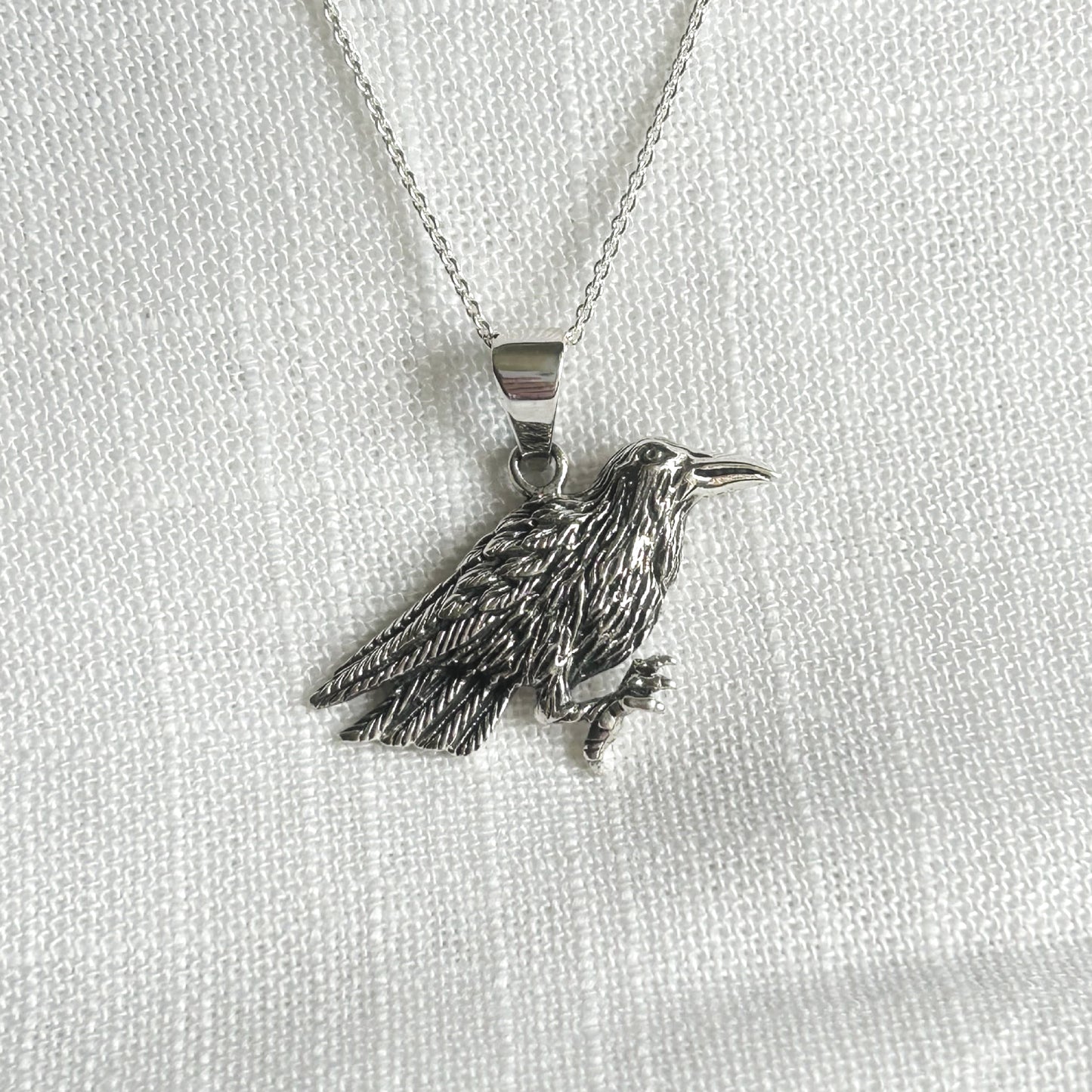 Embrace the mystical allure of the raven with this stunning necklace. The pendant is 3cm long (inc bale) by 3.2cm wide. Add it to your collection today and let the raven become your familiar. All pendants come supplied on a 20 inch Sterling Silver Curb Chain and arrive gift boxed.