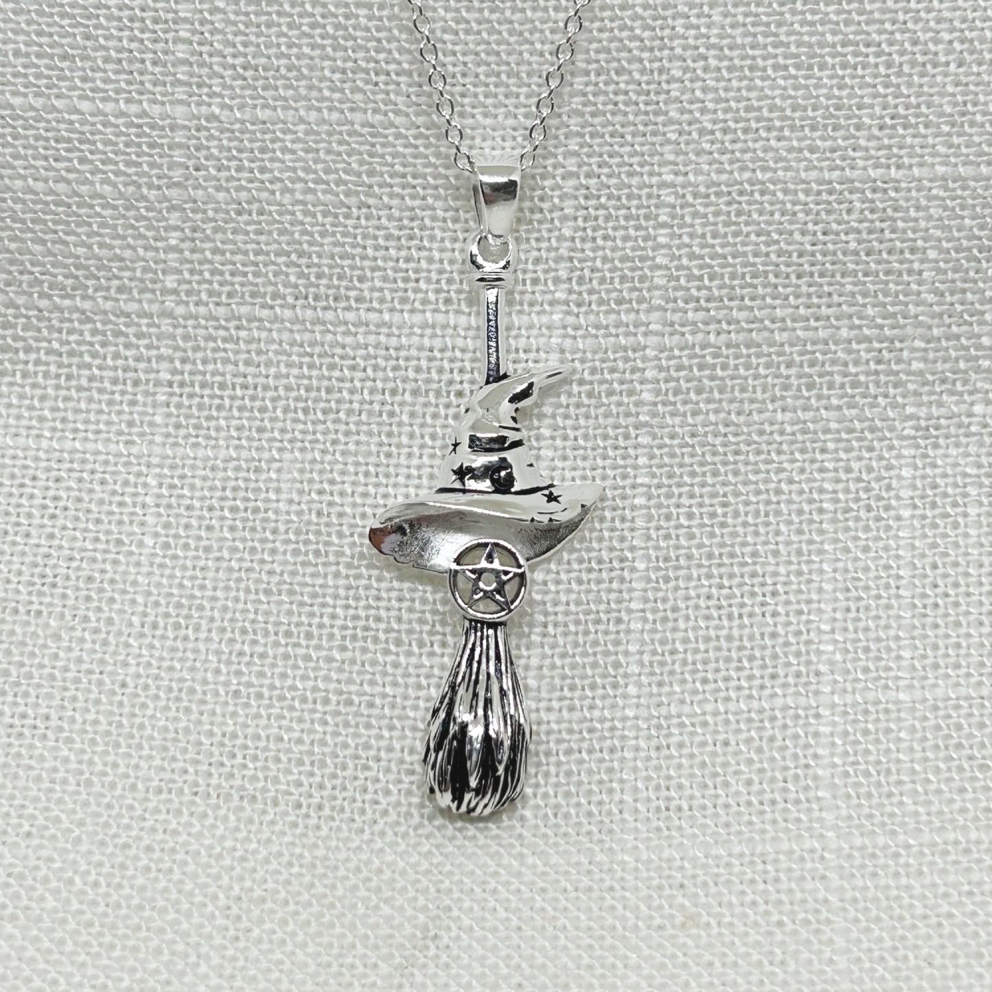 This Witches besom or broomstick and pentacle necklace is 4.25cm long. It has amazing detail with a pentacle and a Witches hat decorated with moon and stars. It comes complete on a 20 inch 925 silver chain. Matching drop earrings are also available