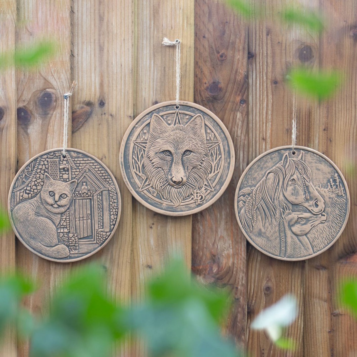 This stunning 20cm terracotta plaque features a Witch's familiar sitting outside a house beckoning you to enter by Lisa Parker. This item comes with a twine loop attached ready for hanging. The plaque features a bronze effect finish. This same design is also available in an antique silver effect. 20cm in diameter