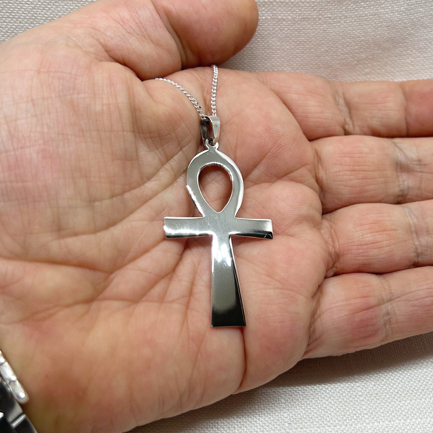 This beautiful extra large Ankh is highly polished and is approx 5.5cms long including the bale. Ankh Drop Earrings are also available. All pendants come supplied on a 20" 925 silver chain and arrives in a tarnish proof bag and gift box.