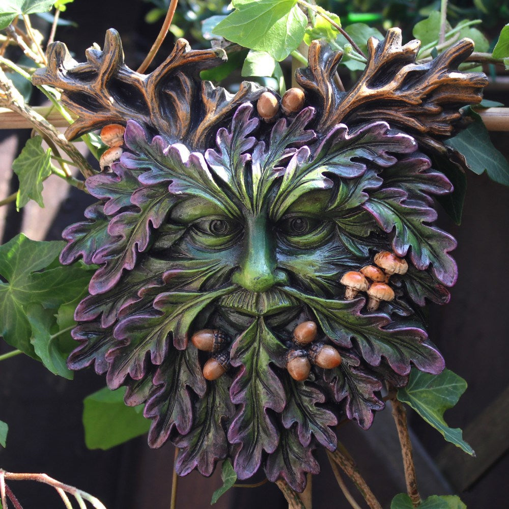 This small Green Man face plaque features great details such as acorns and toadstools amongst his beard foliage. Inspired by the pagan god also referenced to as the Man of the Woods. Size: H: 15cm W: 14.5cm D: 2.5cm