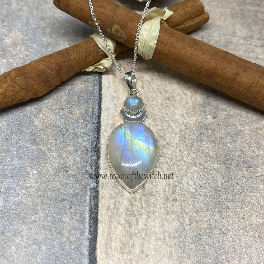 Lovely larger sized pendant set with two rainbow moonstone cabochons, one above and a larger one below with a silver crescent moon between them. Set in 925 Sterling Silver it measures approx 5cm in length (inc bale) x 1.8cm in width. The weight of each pendant is at least 8.8 grams. These pendants come complete with a 20" Sterling Silver Curb Chain