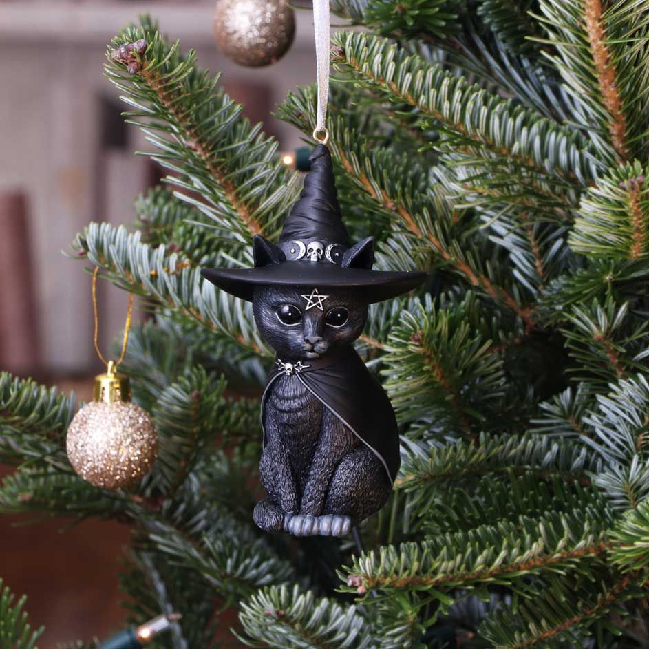 Purrah, the Witch Cat, is the union of good and evil. As you look into its black eyes you notice that all is not as it seems, darkness resides within. The cat appears to be channelling the spirit of the witch, encapsulated by a large pointed hat and smooth cape. The cat is decorated in ornate silver detailing and occult symbology. Cast in high-quality resin and carefully hand-painted.