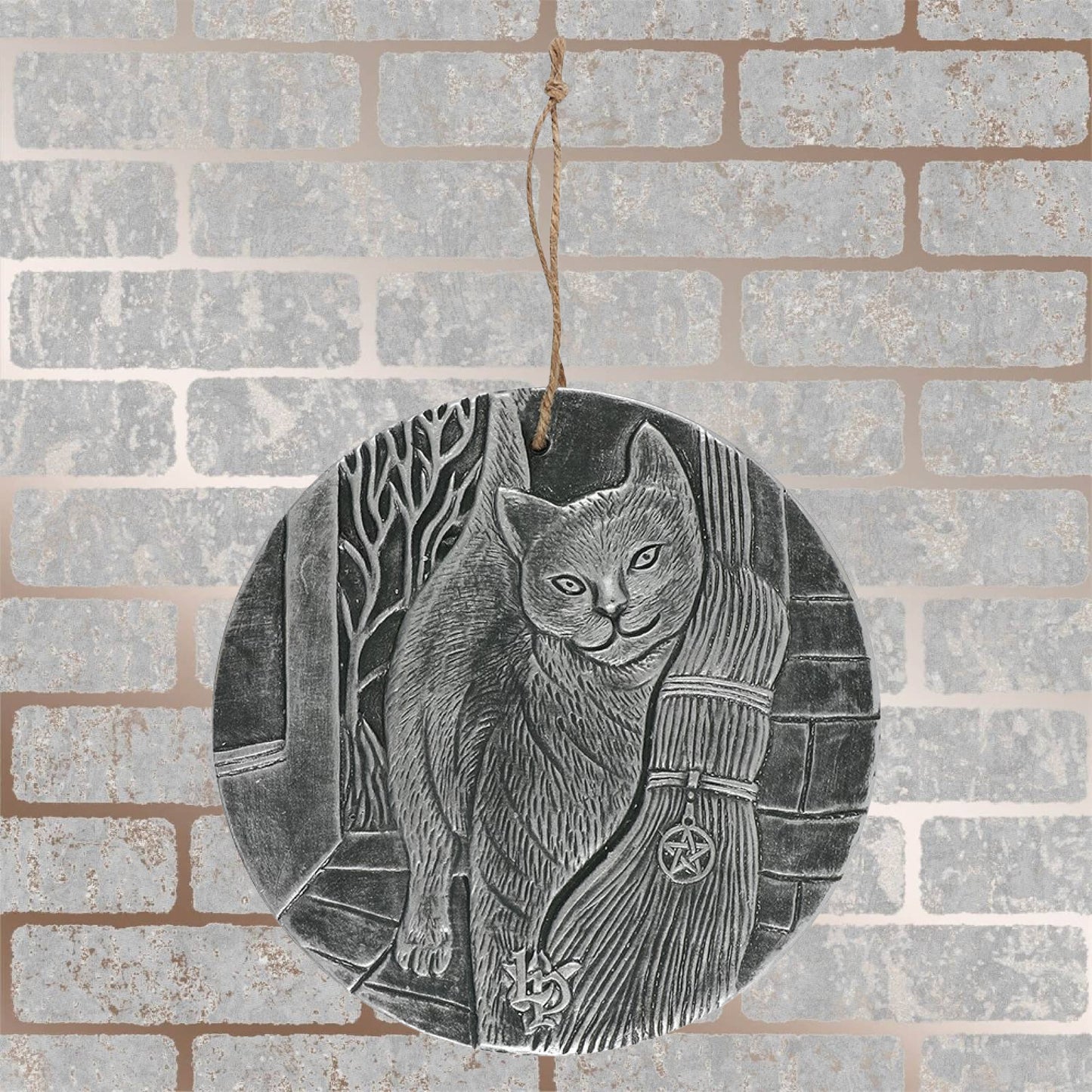 Finished with a silver paint, these stunning terracotta wall plaques depict Lisa Parkers A Brush With Magic artwork featuring a cat and witches broom. 20cm diameter