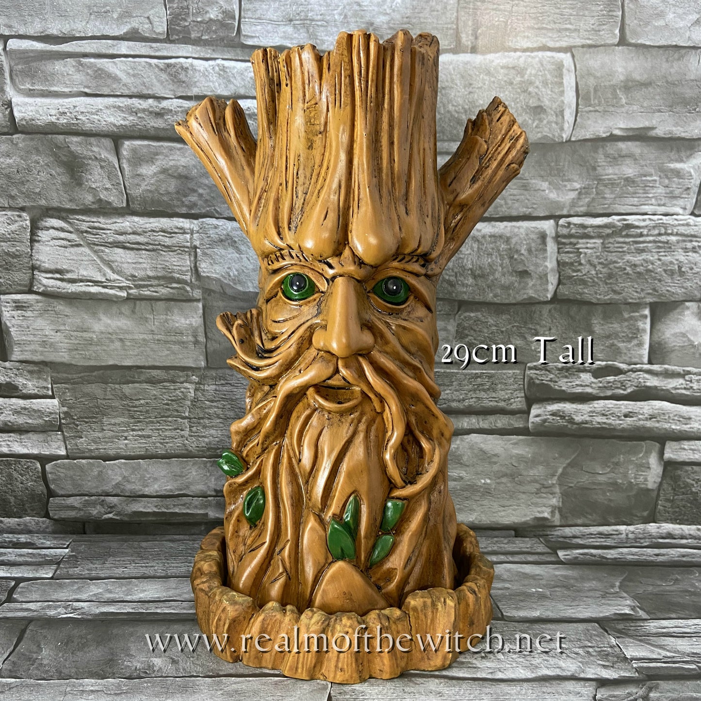 A larger version of the bestselling Tree Man incense cone burner. The Green Man or Man o' the Woods motif appears in many religions and cultures around the world and often symbolises rebirth and the cycle of growth each spring. When the cone is burning, the smoke rises from the top of the tree. Each burner comes with its own picture box. Designed by artist Lisa Parker. Material: Resin Dimensions: H: 29cm x W: 16cm x D: 16cm