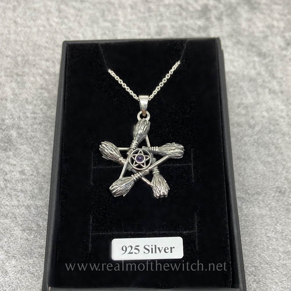 This Witches' besom (pronounced 'bee-som' is a Witches' broomstick) broomstick pendant is just over 3cm long including the bale and comes complete with a 20" sterling silver chain. The 5 besoms have been slightly oxidized to show the detailing, which is set in a circle behind the brooms. There is an amethyst cabochon gemstone set inside the centre of the pentacle. All jewellery comes gift boxed.