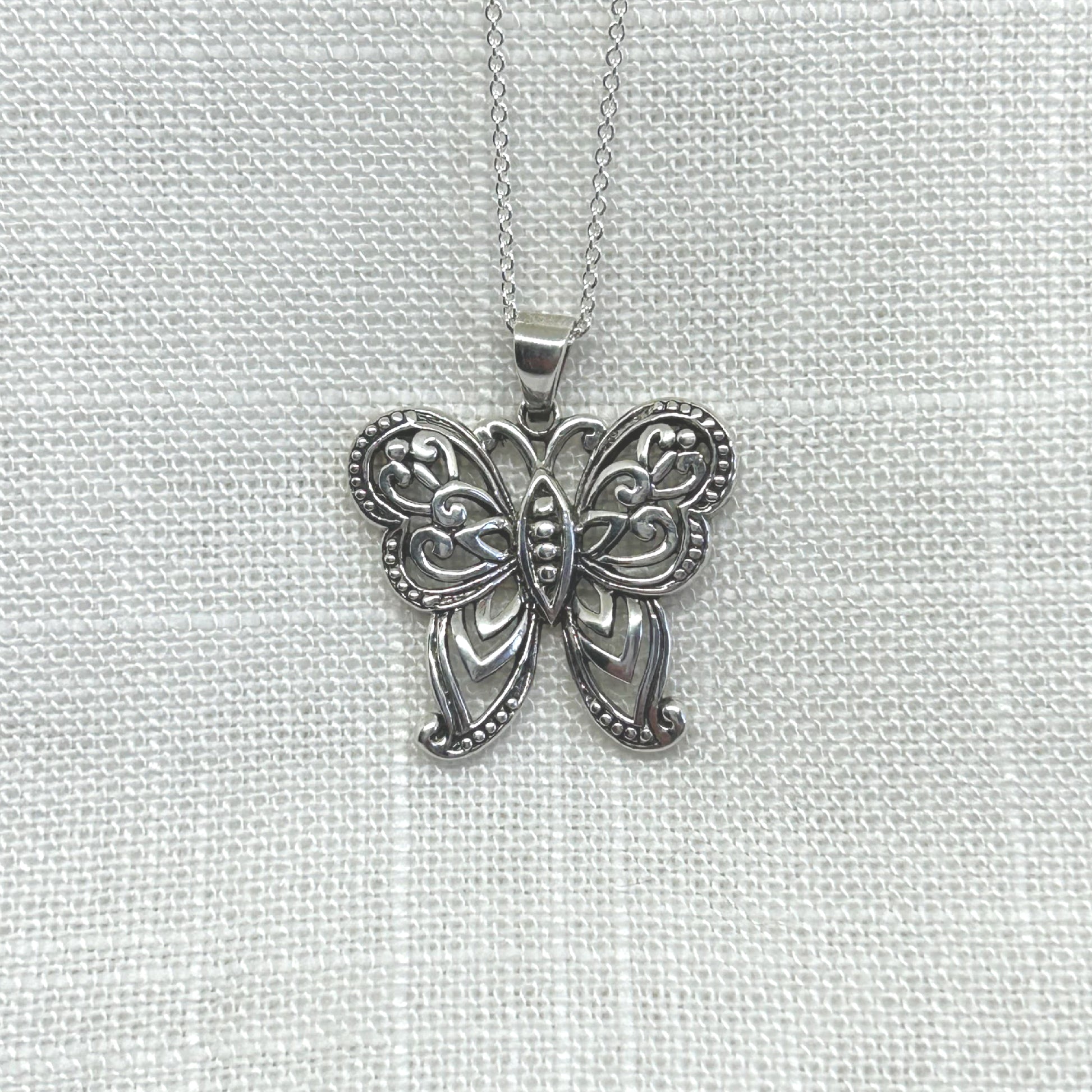 This beautiful butterfly pendant is handmade in 925 silver with slight oxidisation to show off its full potential.  Measuring approximately 2.75cm long including the bale by 2.5cm at its widest point.   This pendant comes complete on a 20 inch 925 silver chain and will arrive in a tarnish proof bag inside a gift box.