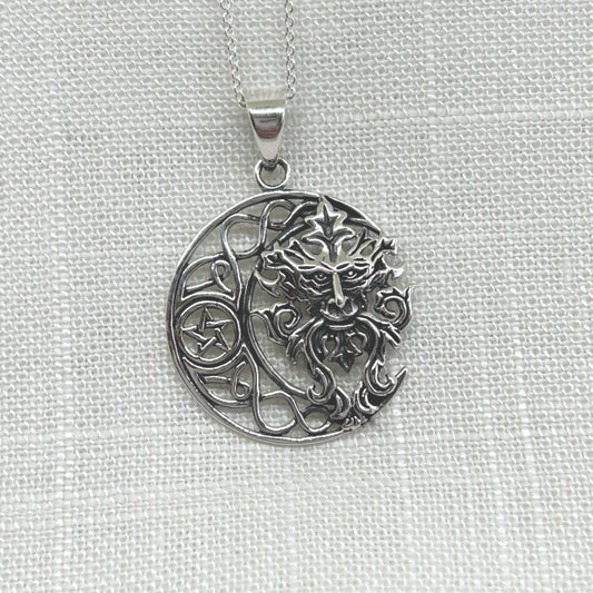 This 925 silver pendant features a Celtic knot style crescent moon with a pentacle within its centre. Filling the space in the moon is a gorgeous Green Man, the mysterious Pagan God who is a protector of all wildlife, woodlands and nature that dates back to medieval times. He is also known by many other names such as Jack o' the Green, Cernunnos, John Barleycorn and Herne of the Hunt. The pendant is approximately 3.6cm long including the bale by 2.6cm wide. Total weight is 7g.