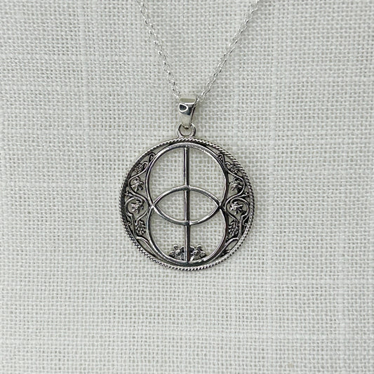 A stunning smaller sized pendant set in .925 silver of the Glastonbury Chalice Well Cover. The size of this pendant is approx 2.5cm wide x 3.2cm long including the bale. It comes on a 20" sterling silver chain and all jewellery comes gift boxed. RRP £38.04.