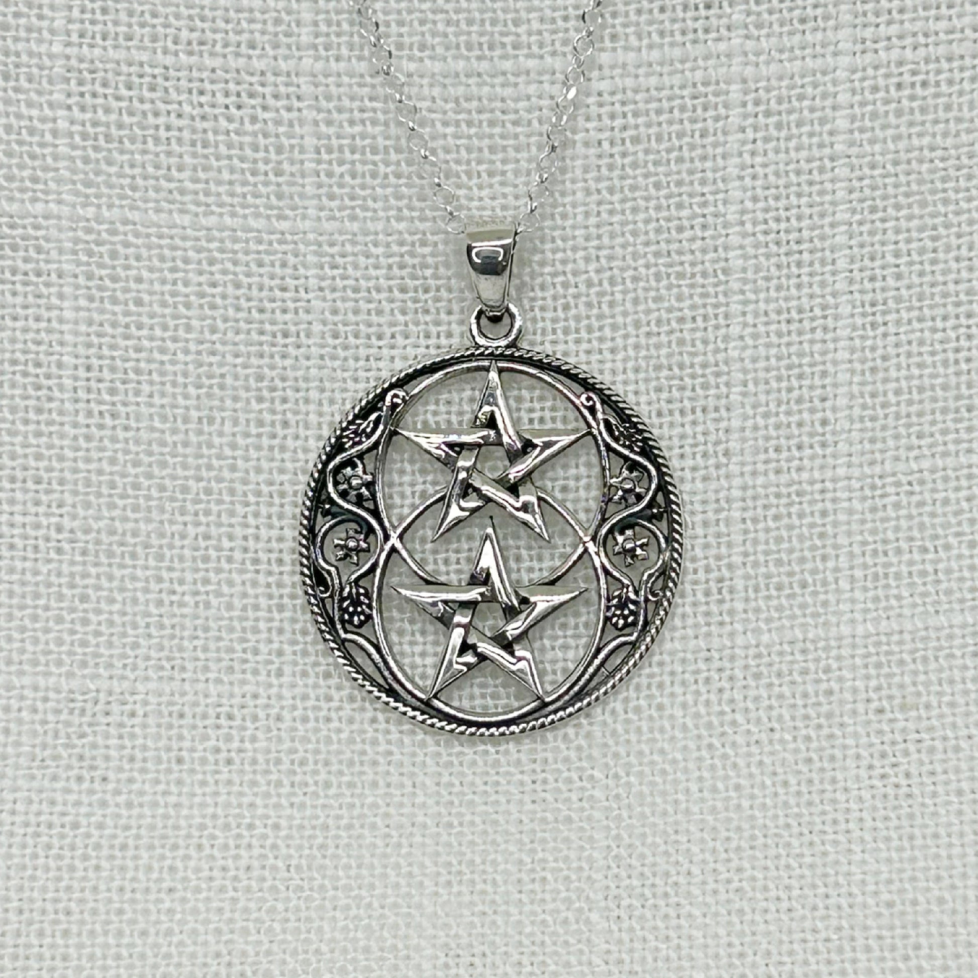 This beautiful Chalice Well themed Necklace is inspired by the well at the heart of Glastonbury and features two Pentagrams.  The size of the pendant is 3.1cm long (including the bale) by 2.4cm in diameter.  The pendant comes on a 20" sterling silver chain and arrives in a tarnish proof bag inside a gift box.