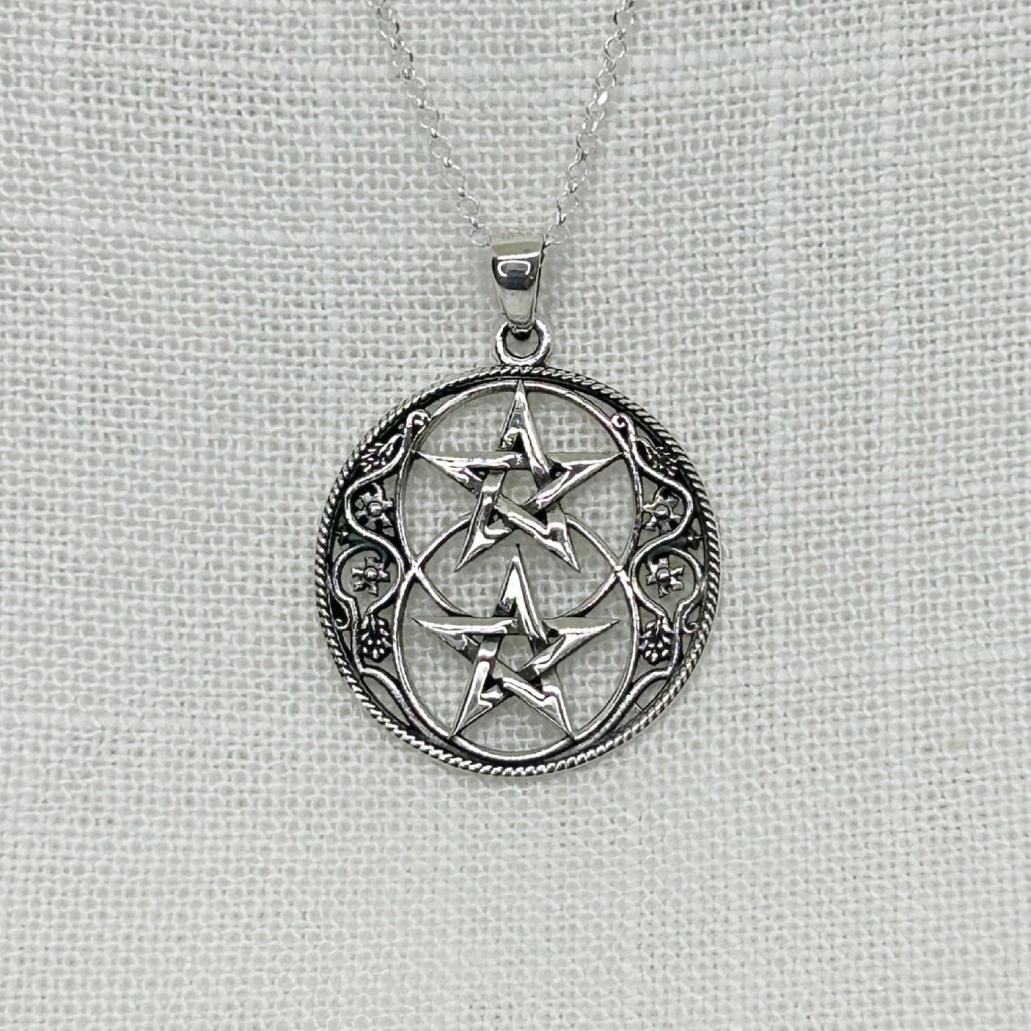 This beautiful Chalice Well themed Necklace is inspired by the well at the heart of Glastonbury and features two Pentagrams.  The size of the pendant is 3.1cm long (including the bale) by 2.4cm in diameter.  The pendant comes on a 20" sterling silver chain and arrives in a tarnish proof bag inside a gift box.