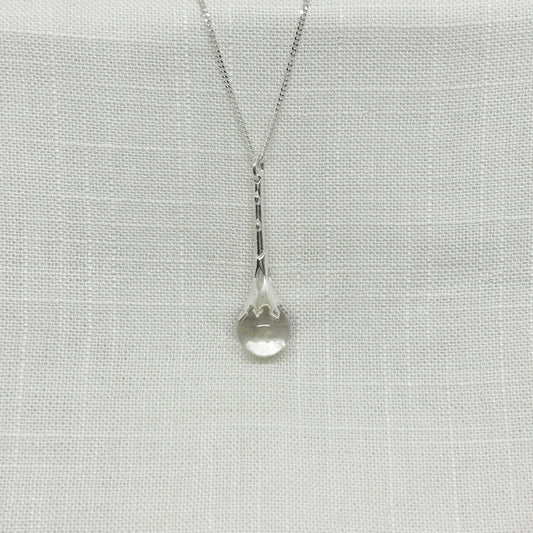 This beautiful crystal ball scrying wand necklace is set in 925 silver.  Parts of the wand have been carved in places to allow the light to shine down through the wand to give the quartz crystal ball more clarity.  The pendant is approximately 4.5cm long including the bale with the crystal ball measuring 1.2cm in diameter.  The pendant comes complete on a 20 inch sterling silver chain and arrives in a tarnish proof bag inside a gift box.