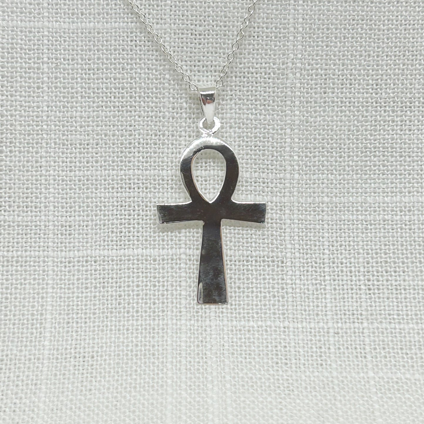 This beautiful Ankh is highly polished and is approx 3.9cms long including the bale.  All pendants come supplied on a 20 inch silver chain and arrive in a gift box. Ankh Drop Earrings and XL Ankh Necklace are also available on the website