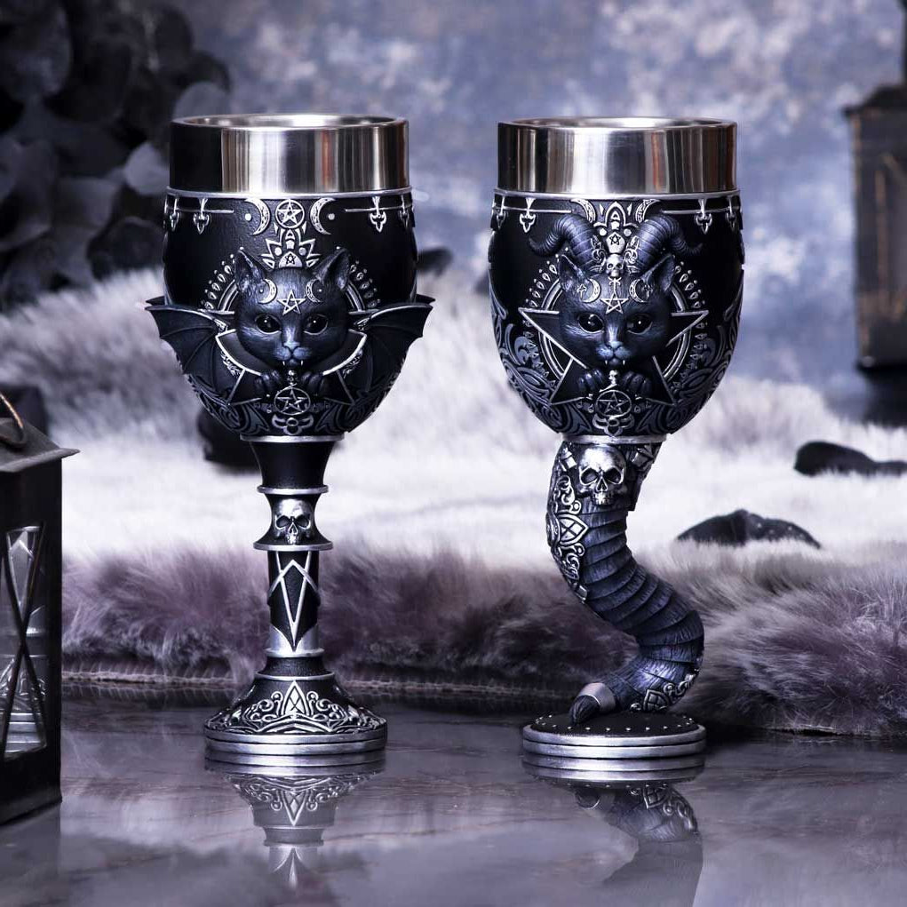 Malpuss and Pawzuph have been transformed into these fully functional goblets.  Malpuss, the black cat appears to be a vampire spirit.  Pawzuph appears to be the spirit of Baphomet, encapsulated by horns.  The goblets are each decorated with ornate silver detailing.  Ideal gift for a couple who love anything a little out of the ordinary. 19.5cm each
