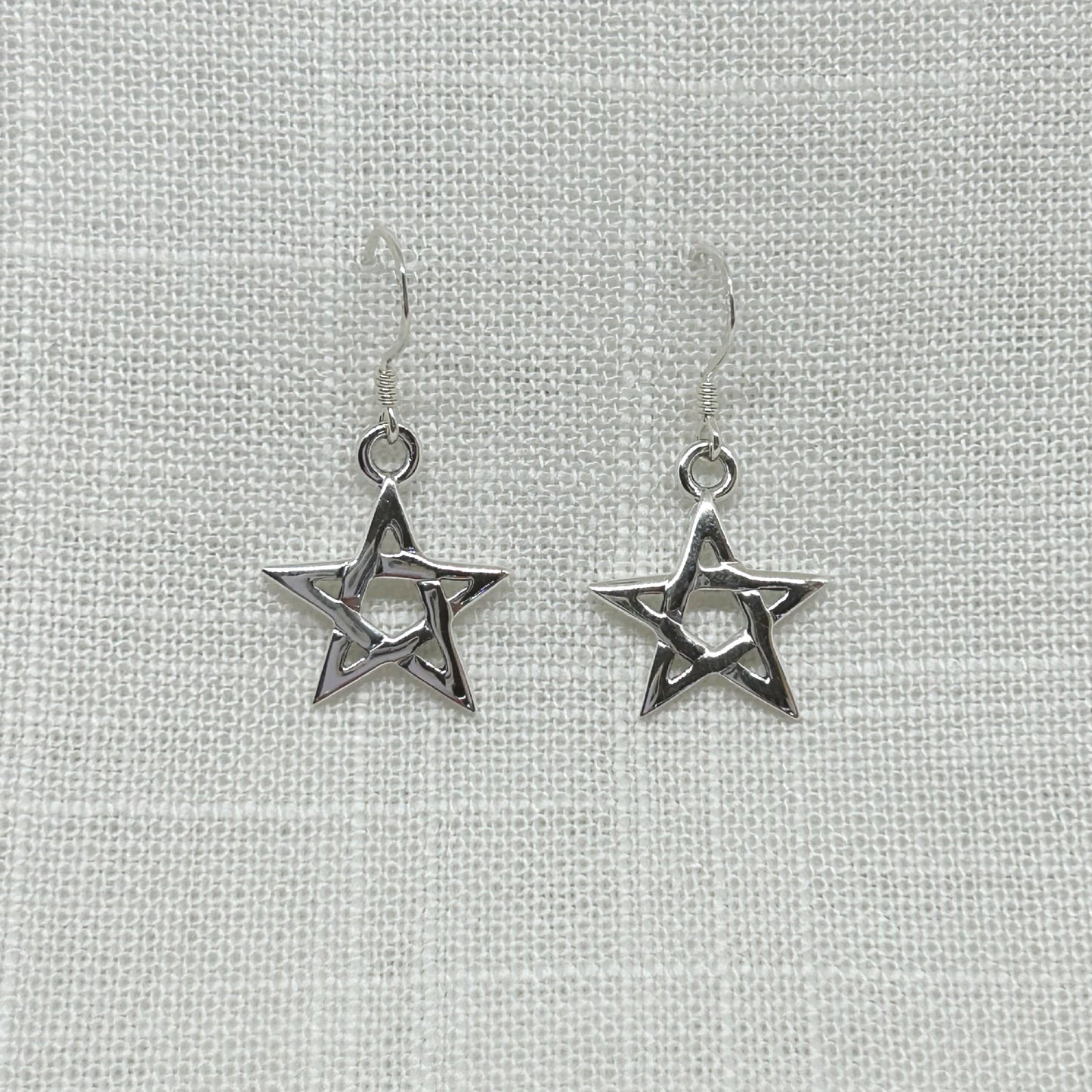 These beautiful silver pentagram earrings have a high polish so they look stunning. They are approx 1.75cm wide by 3.25cm long incl hooks. All earrings are non returnable due to hygiene reasons