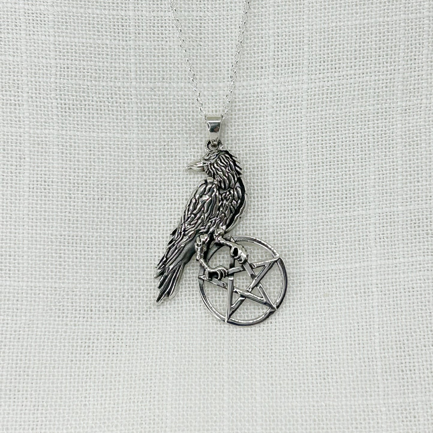 This .925 silver raven clutches on to his pentacle as he looks around him. Including the bale the pendant is approx 4cm long and comes with a 20" sterling silver chain and is gift boxed.