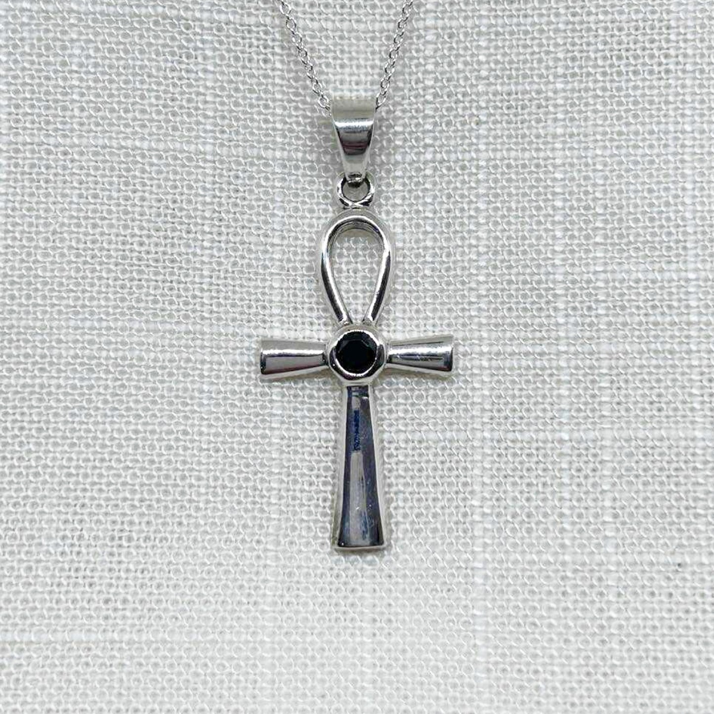 This highly polished .925 Silver Ankh pendant is presented with a faceted black Agate gemstone, said to be a stone for grounding, protection, and strength, measures 4cm including the bale x 1.8cm wide. All pendants come supplied on a 20 inch silver chain and arrive in a tarnish proof bag inside a gift box.