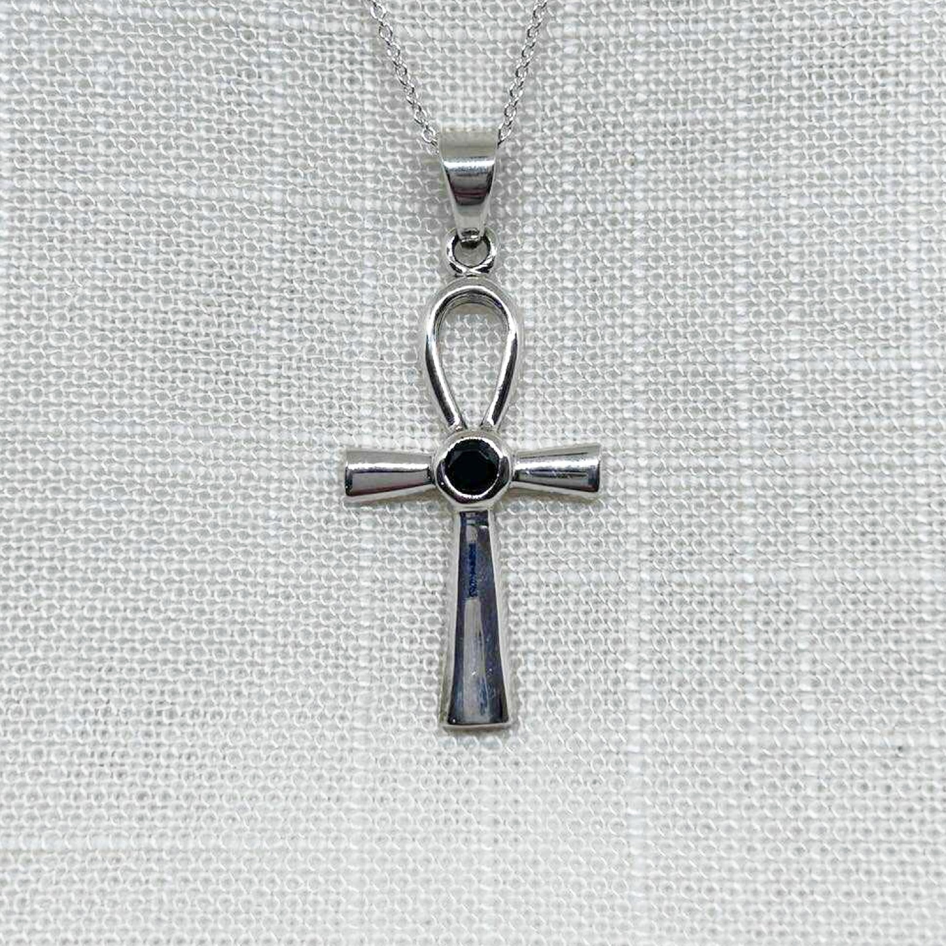This highly polished .925 Silver Ankh pendant is presented with a faceted black Agate gemstone, said to be a stone for grounding, protection, and strength, measures 4cm including the bale x 1.8cm wide. All pendants come supplied on a 20 inch silver chain and arrive in a tarnish proof bag inside a gift box.