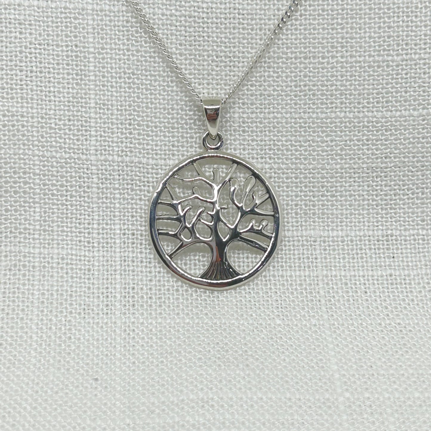 This beautiful tree of life pendant is slightly convex with a high polish, giving it a great finish. The large detailed tree sits within an outer circle. The size of the pendant is approx under 2.4cm wide & 3cm long incl the bale. Comes complete on a 20 inch sterling silver chain and is gift boxed.