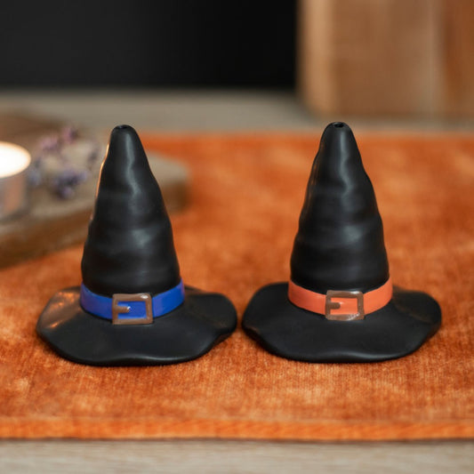 Introduce a hint of enchantment to the kitchen with this captivating set of Witch Hat Salt and Pepper Shakers.  Crafted in the image of traditional witch hats, this duo of shakers is sure to spark conversation at Halloween-themed gatherings.