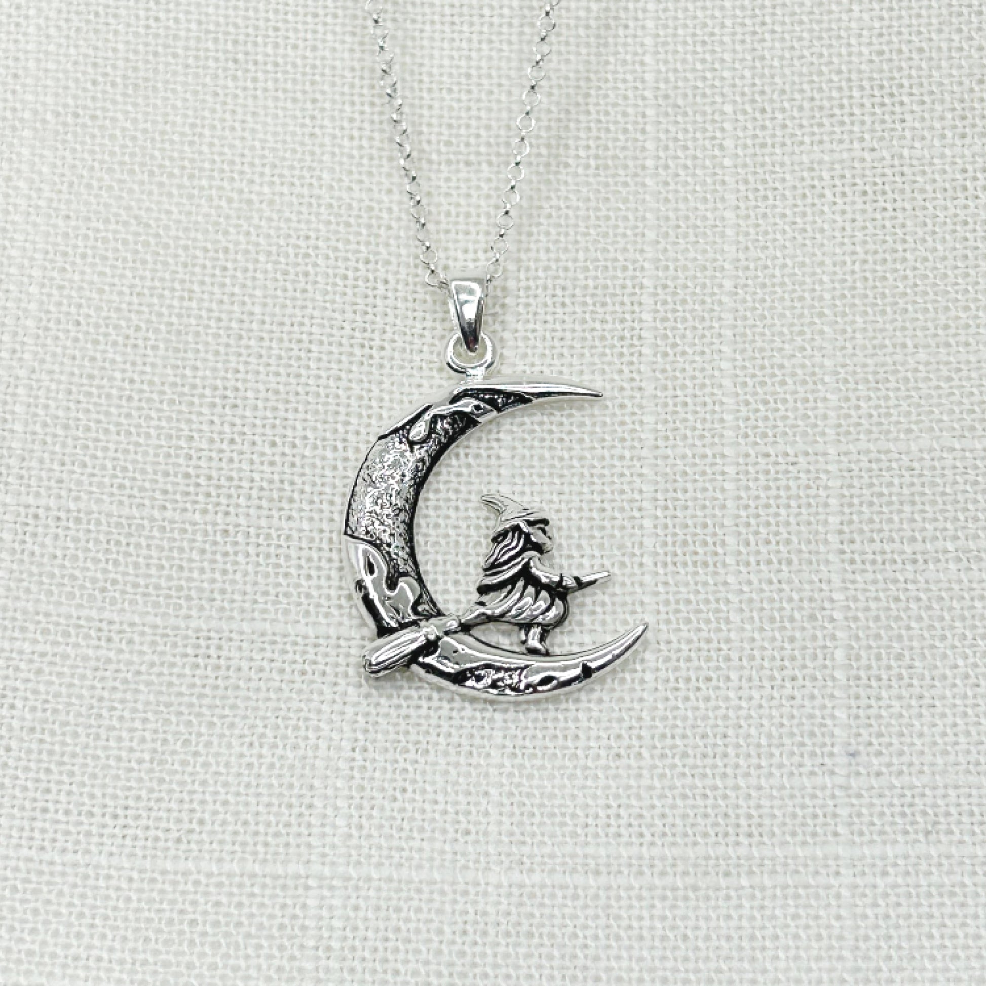 This 925 Silver Witch and Moon pendant has wonderful detailing. The Witch is flying across a crescent moon on her trusty broomstick. The moon has been slightly oxidized to show off it's craters and crevices perfectly, as has also the little Witch, with her long hair, wearing a cloak and her pointed hat. The pendant measures approx 3.25cm in height including the bale x 2cm wide. This piece comes complete on a 20 inch 925 chain. All jewellery comes gift boxed.