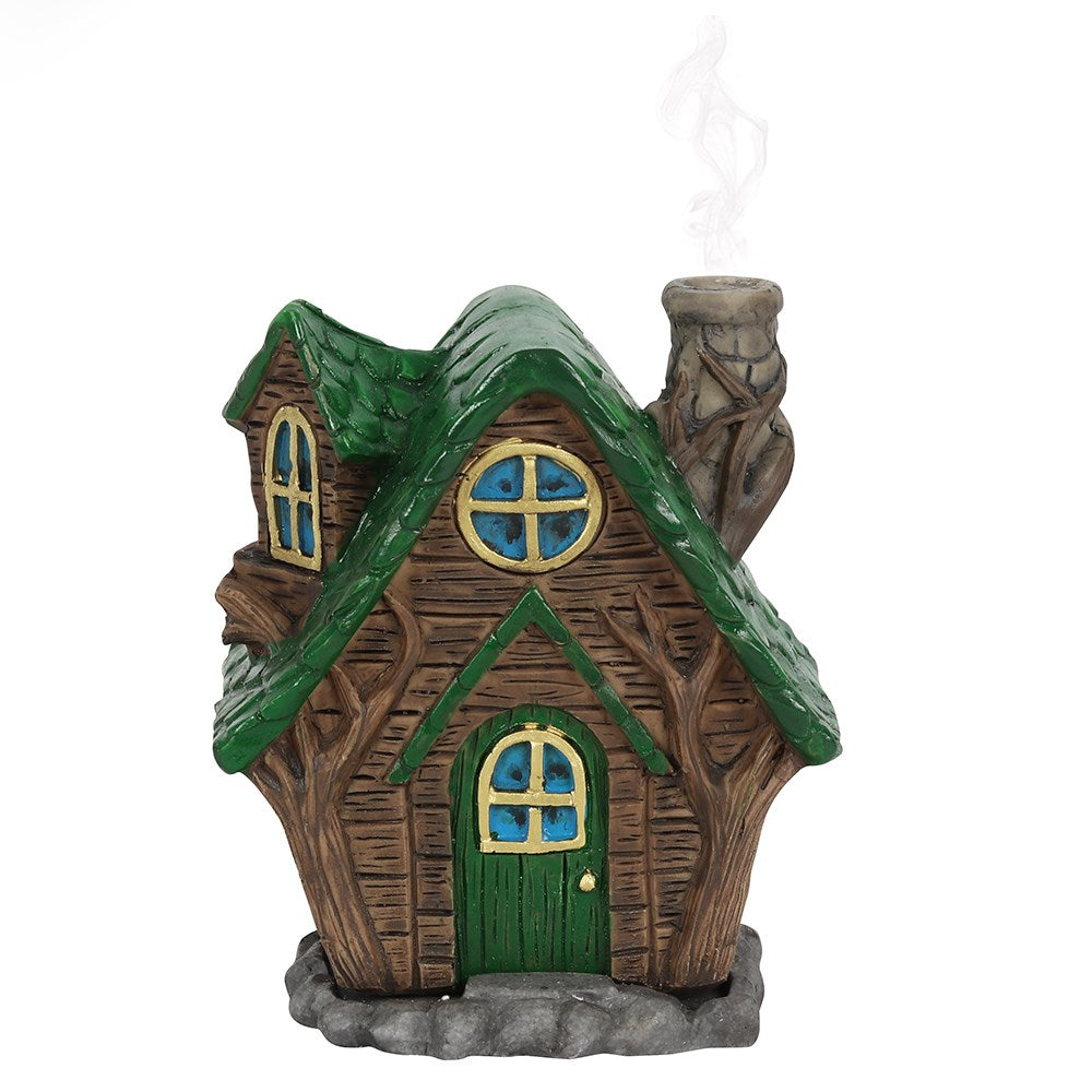 A magical 'wooden' style fairy house incense cone burner with a green tiled roof and matching front door. When the cone is burning, the smoke rises from the chimney. Each comes with its own picture box. Designed by Lisa Parker.