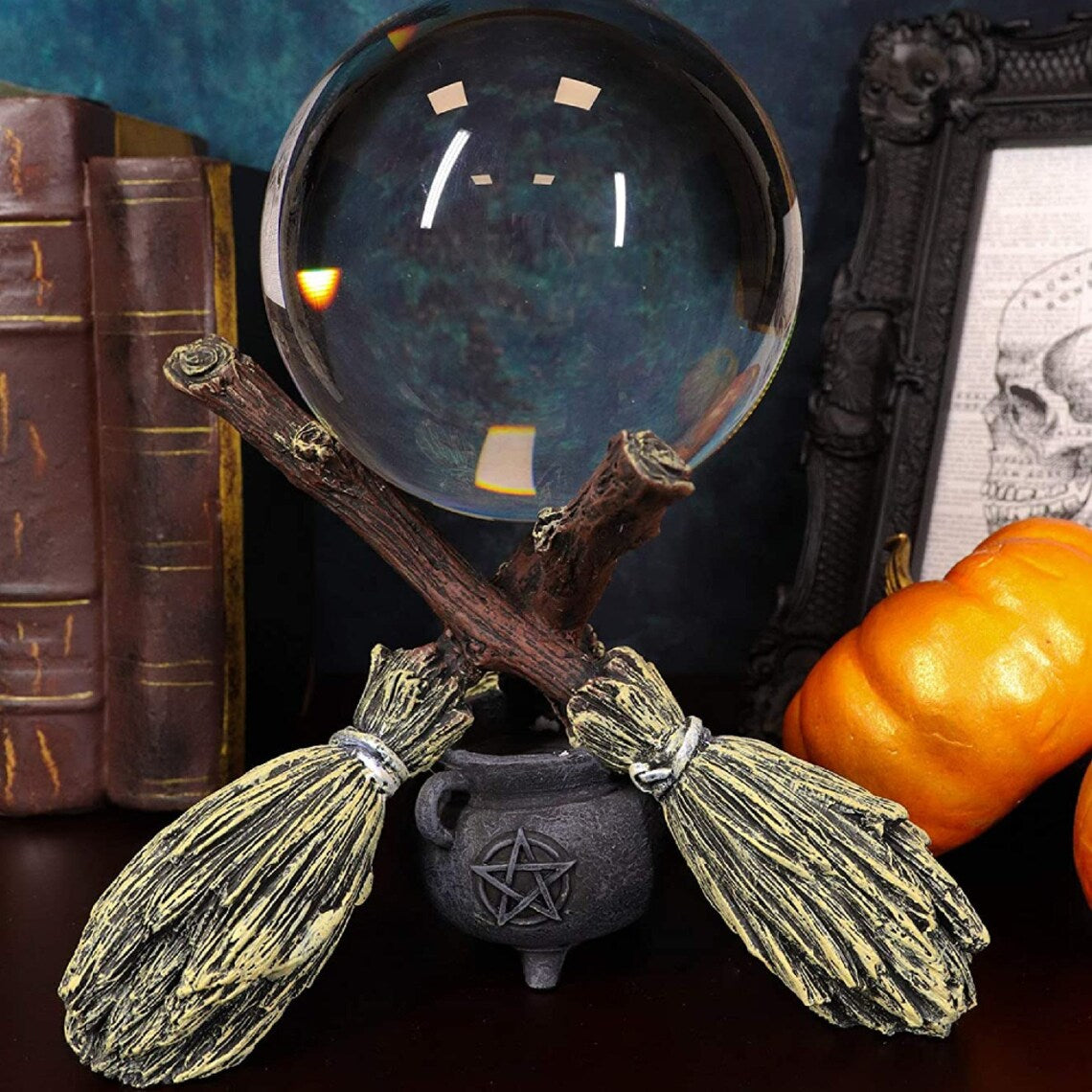 This Broomstick Crystal Ball Holder is perfect for any aspiring fortune teller.  Featuring three witches broomsticks (or besoms), a cauldron and a pentagram, this sturdy holder is the ideal solution for displaying and protecting your crystal ball.  It will comfortably hold an 11cm Crystal Ball (sold separately).