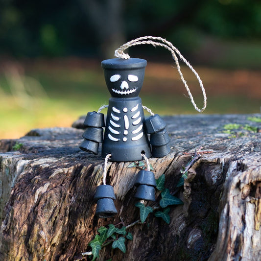 Uh oh! This bestselling terracotta pot man is looking a little grim!  Spook up an outdoor space with this deadly skeleton pot man by hanging him up or having him sit on the edge of a garden wall.  A truly unique gift for the non traditional gardener. Also available on the website in white.  Dimensions H 15cm x W 5.5cm x D 11cm