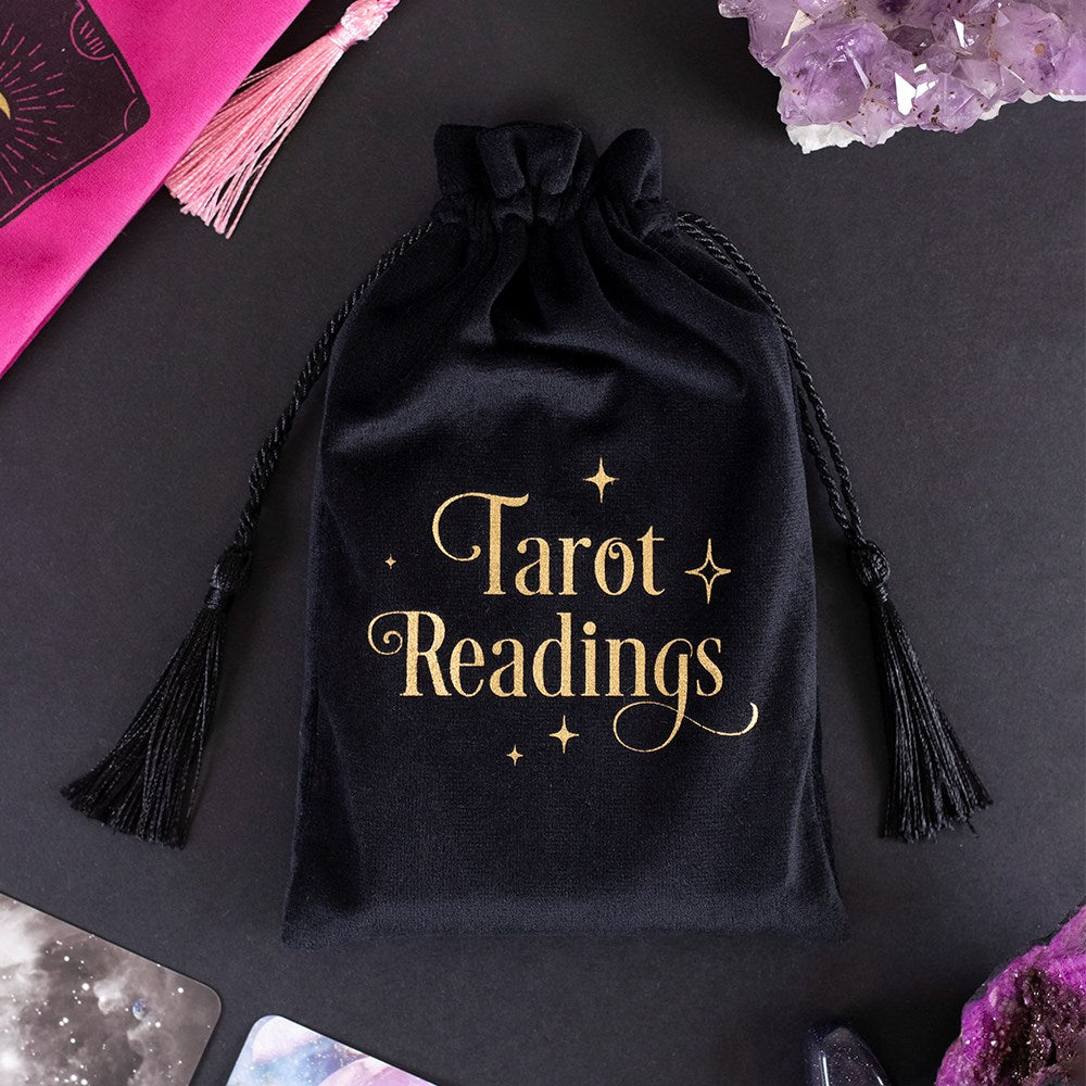 This velvet drawstring bag is the perfect place to keep tarot decks and oracle cards when not in use. Soft and luxurious with gold 'Tarot Readings' text on the front. In this collection of drawstring bags are also: Moon Tarot Card and a Pink Tarot Cards design. Size: H: 20cm x W: 13cm x D: 0.5cm Material: Polyester