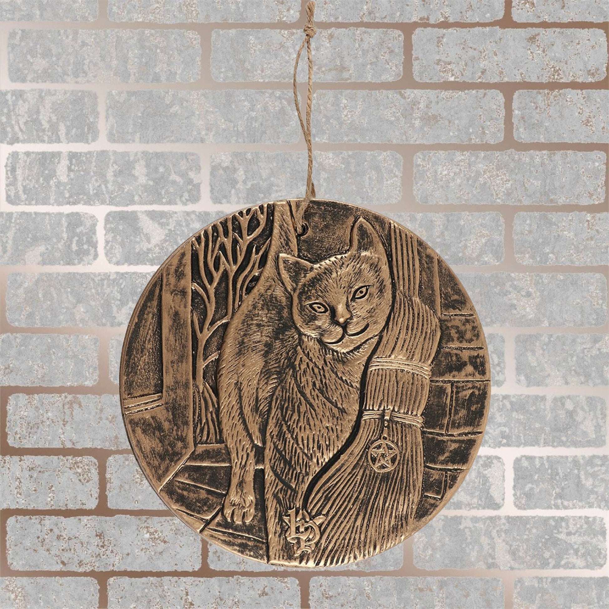 Finished with a bronze paint, these stunning terracotta wall plaques depict Lisa Parkers A Brush With Magic artwork featuring a cat and witches broom. 20cm in diameter