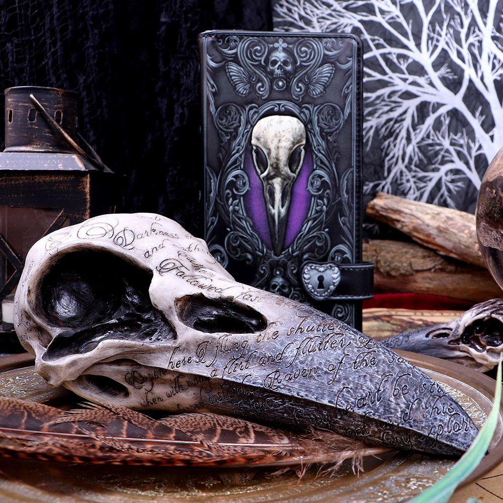This super size resin cast raven skull embodies engraved words in black from Edgar Allan Poe's famous poem, The Raven. The hand painted detailing makes it look life-like except for it's size. It's weight is substantial enough to make a decorative paperweight for anyone with a passion for Poe's Gothic writings, to display on an altar or mantle.