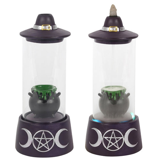 This impressive backflow cone burner is enclosed in a glass cylinder and features a bubbling cauldron, triple moon base and witch's hat lid. 4 LED lights gently cycle through a stunning rainbow of colours, beautifully showcasing the falling smoke that pools over the enclosed cauldron. Bottom on/off switch. Requires 2 AA batteries (not supplied).
