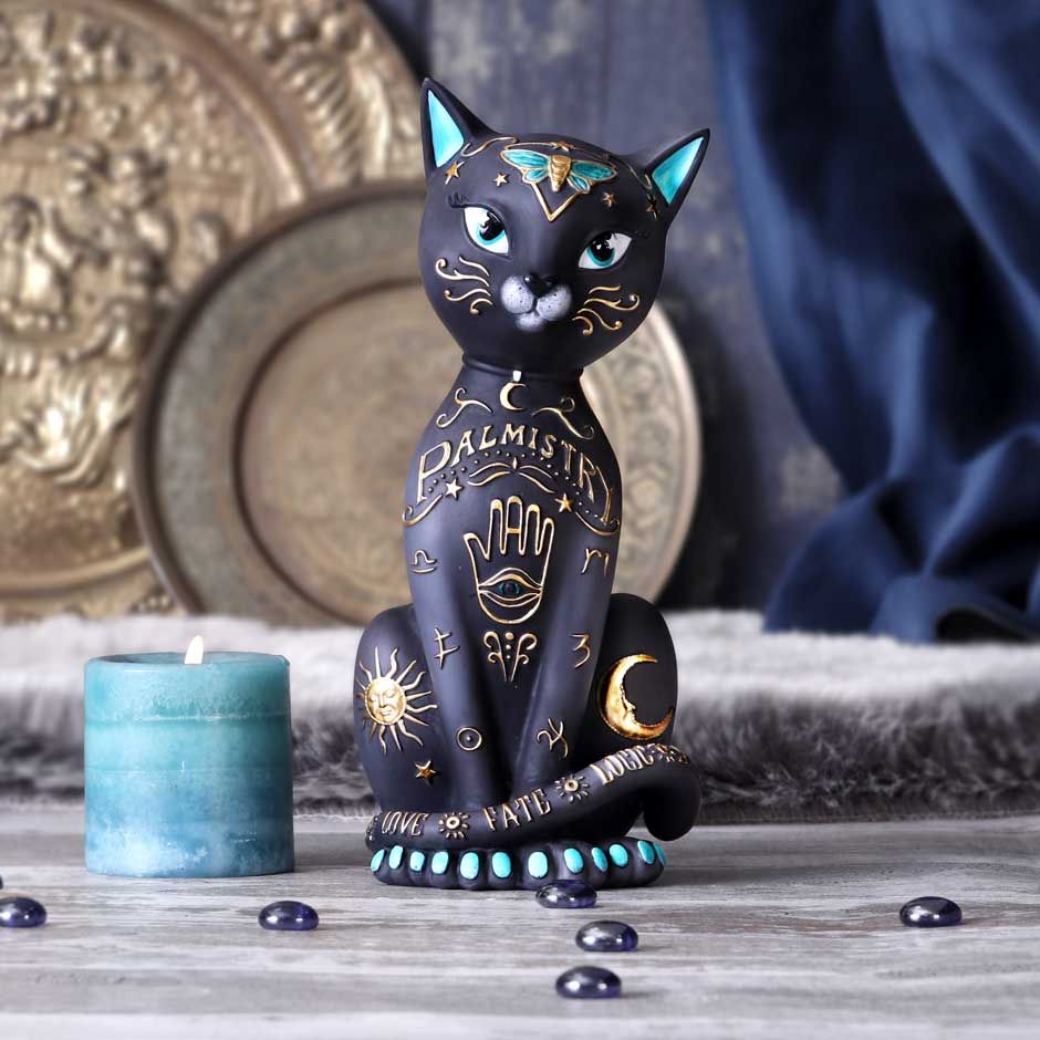 Palmistry otherwise known as Chiromancy is the claim of characterisation and foretelling the future through the study of the palm. This mysterious kitty sits looking at you inquisitively. Gold palmistry symbols covers their fur with a sun and crescent moon placed on their back legs. Cast in the finest resin before being expertly hand-painted, this Fortune Kitty will add a touch of spirituality to any home. Size 29cm
