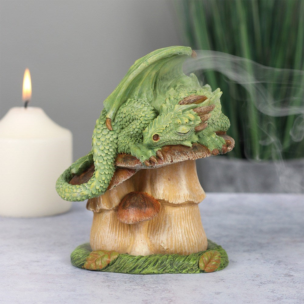 Designed by Anne Stokes, this eye-catching incense cone burner features a green dragon sleeping on top of a toadstool. When an incense cone is lit and placed inside the smoke from the cone will flow through the top of the burner for an impressive feature piece.