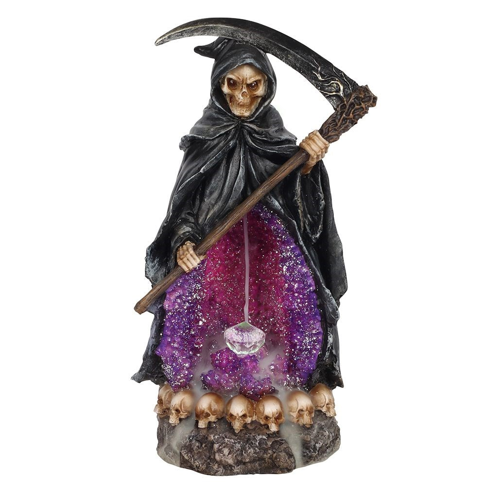 This captivating backflow burner features a foreboding grim reaper and his scythe. A clear resin crystal lights up while smoke gently cascades through a glimmering crystal cave. Powered by an on/off switch and 2 AA batteries (not included). 