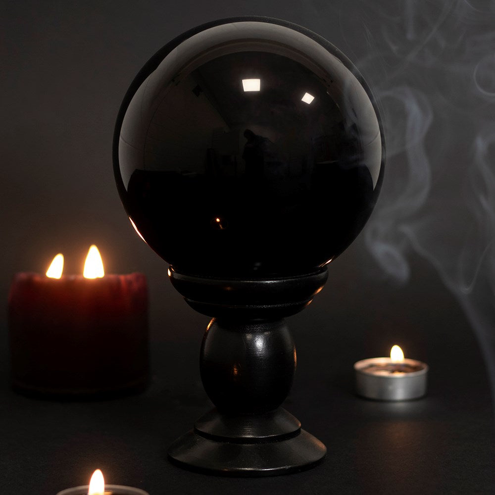 This large glass black crystal ball is not only a tool to aid in fortune telling and scrying, but also makes an eye-catching piece of décor. Comes on black wooden stand. *Warning* Keep out of direct sunlight. Material: Glass & MDF Wood Size: H: 20cm x W: 13cm x D: 13cm