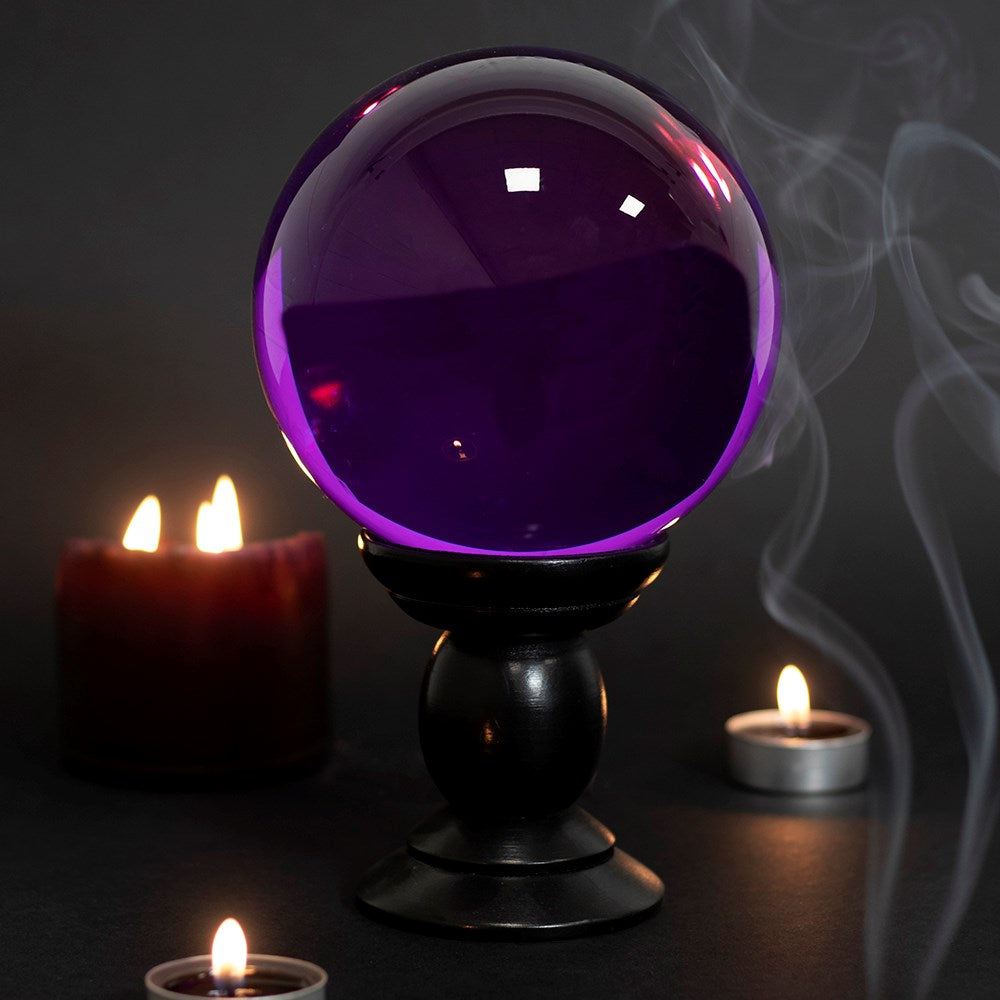 This large glass purple crystal ball is not only a tool to aid in fortune telling and scrying, but also makes an eye-catching piece of décor. Comes on black wooden stand. *Warning* Keep out of direct sunlight. Material: Glass & MDF Wood Size: H: 20cm x W: 13cm x D: 13cm