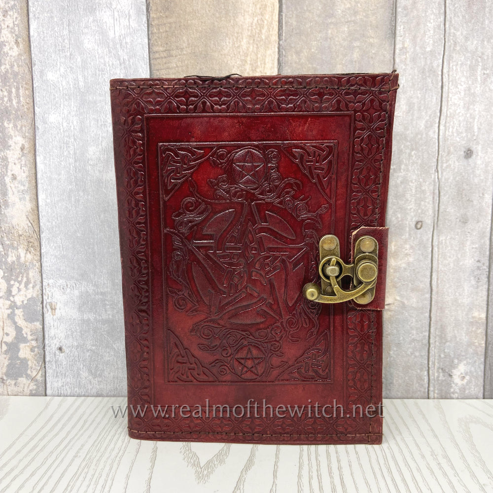 Bound in brown leather, this book comes with one metal clasp, keeping it from falling open unexpectedly. The cover is embossed with a central pentagram that is surrounded by Celtic floral patterns and small pentagrams, bordered with intricate patterns. Inside, high-quality plain paper gives you the freedom to record your thoughts and dreams unimpeded.