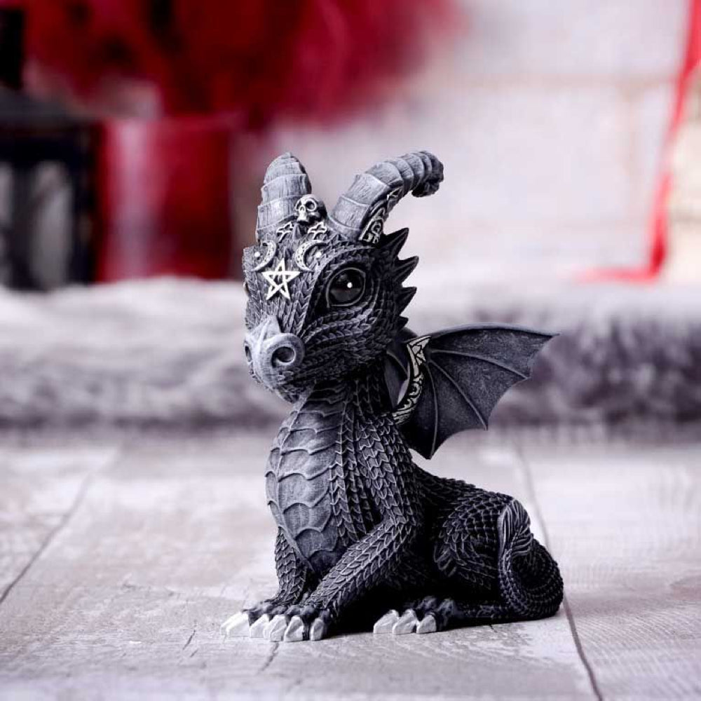 Lucifly is one of the latest in the Cult Cuties Collection of an adorable baby Dragon. Featuring occult symbology and ornate silver detailing, this dragon rests their wings and gazes proudly out at all those who pass by. Cast in high-quality resin before being carefully hand-painted, this figurine is likely to be the cutest occultist you've ever seen.