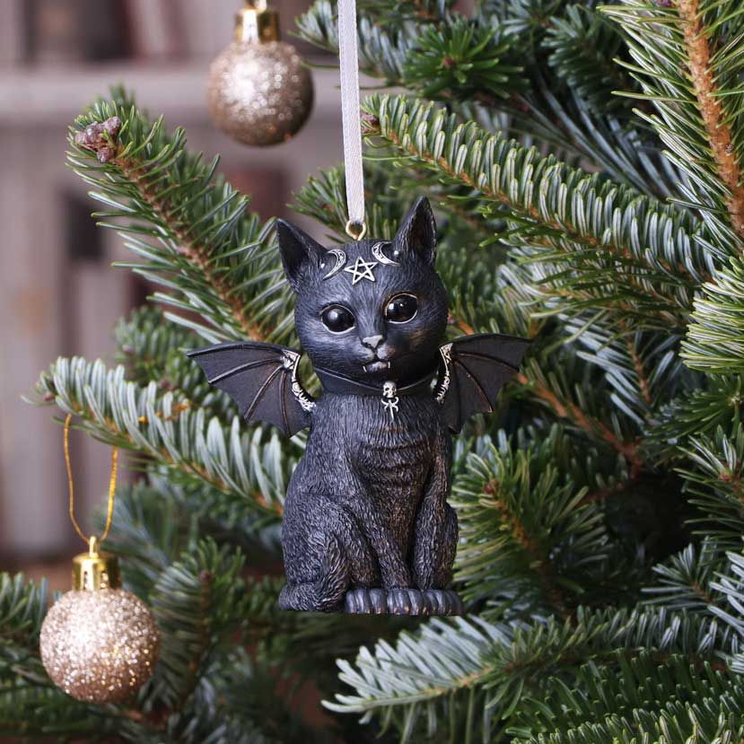 This cat is the union of good and evil. The black cat, sits and stares at you adoringly. As you look into its black eyes you notice the darkness that resides. Inside of this cat appears to be a vampire spirit, encapsulated by bat wings protruding from the cat's back, and its abnormally large canine teeth. The cat is decorated in ornate silver detailing and satanic symbology. Cast in high-quality resin and carefully hand-painted. 