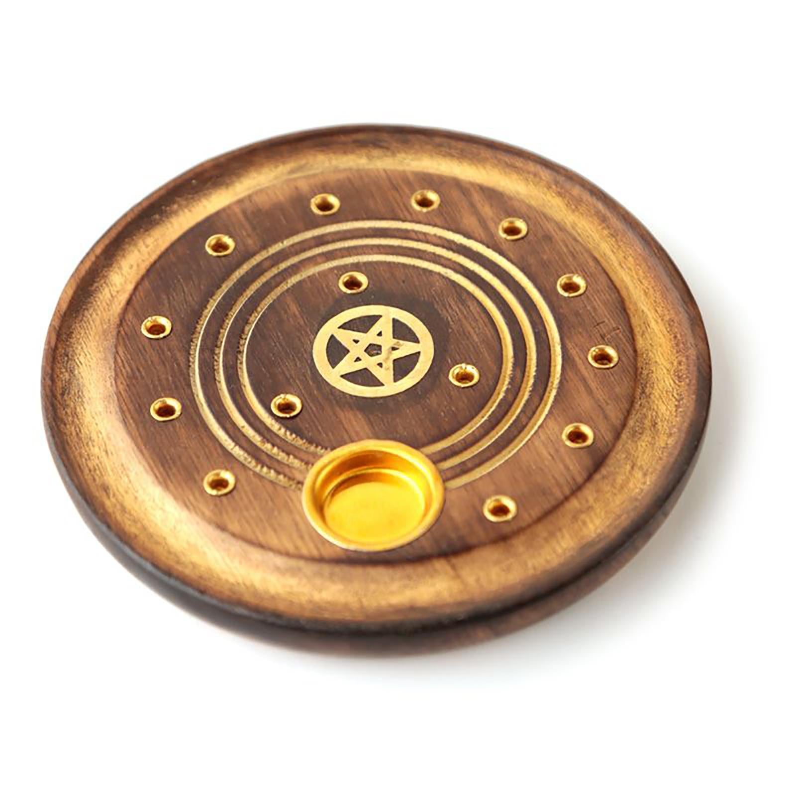 Made from mango wood, this incense holder has room for cones or sticks. Designed with a brass pentacle inlay within the centre.  Material: Wood Size: H: 1cm W: 10cm D: 10cm