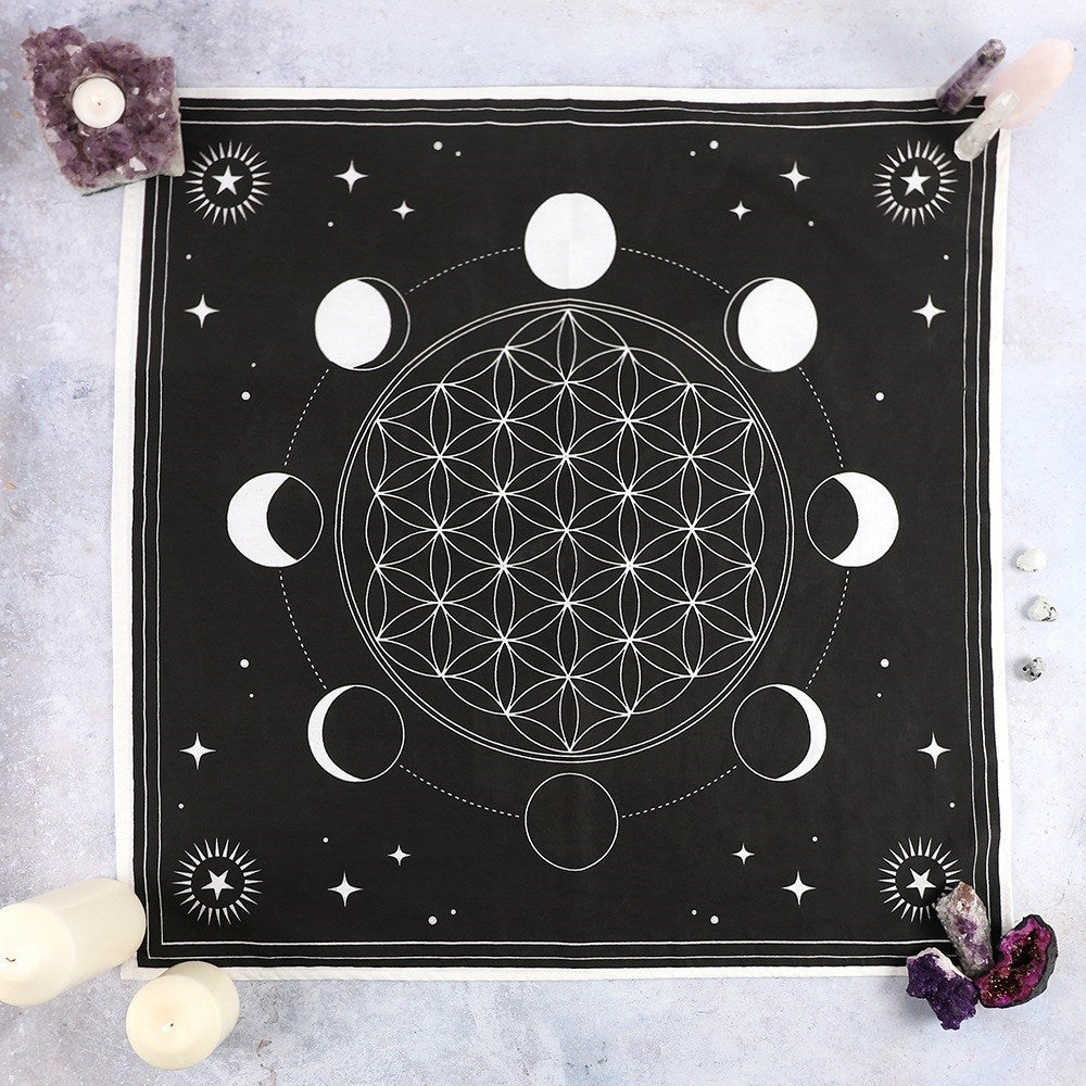Channel the powerful energy of crystal healing with this cotton altar cloth with printed moon phase design and Flower of Life crystal grid printed in its centre. Perfect for arranging crystals and clearing the mind.   Material: Cotton. Size: 70 x 70cm