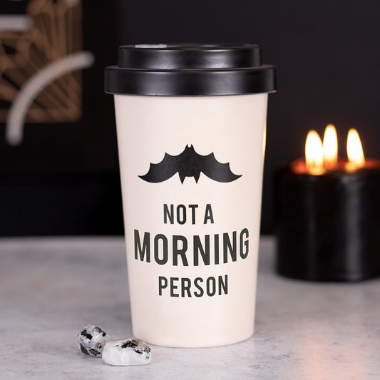 This eco-friendly, reusable travel mug is made out of durable bamboo fibre and comes with a matching silicone sleeve and lid for keeping hydrated (and caffeinated) on the go. This gothic style features 'Not a Morning Person' text under a hanging bat silhouette and also includes a convenient stopper to prevent accidental spills.