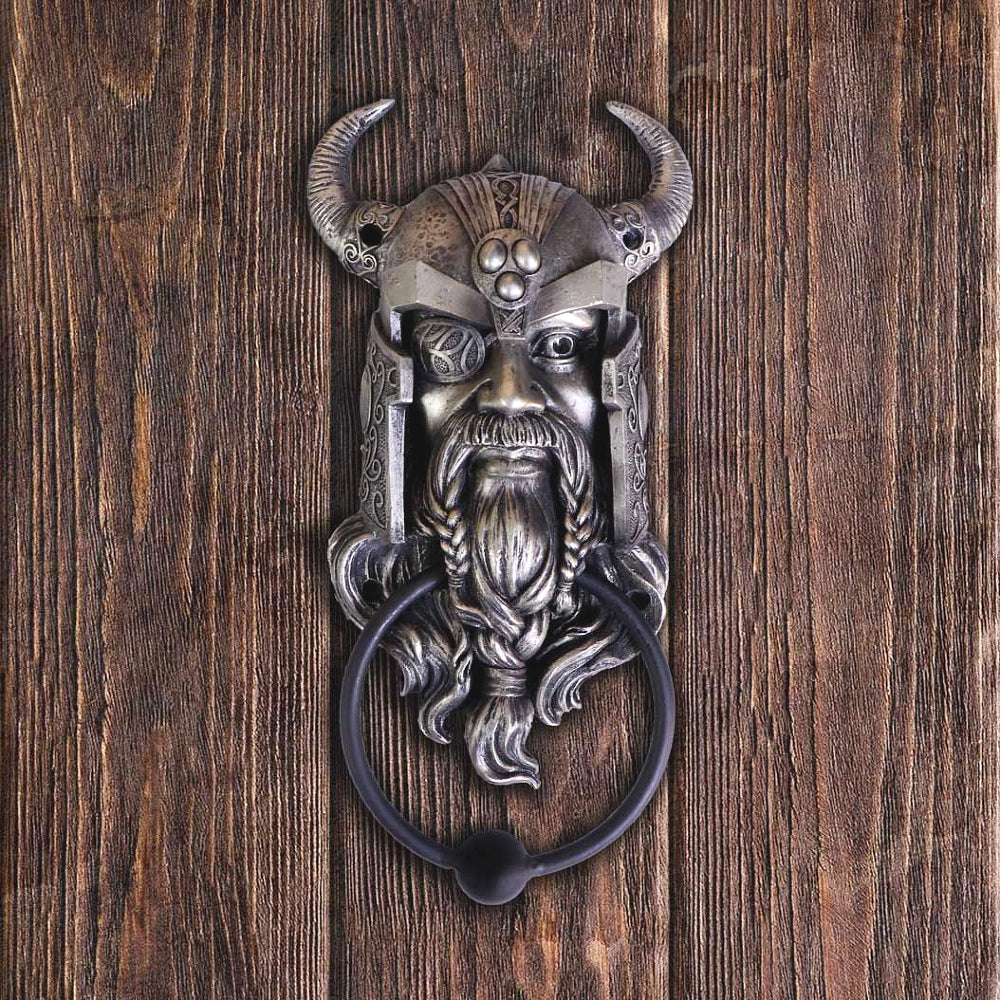 This magnificent sculpture would take pride of place on anyone's front door! Odin, the All Father, Norse God of wisdom, magic, war as well as bloodshed. He has a long beard and moustache, plaited together below his chin. One of his eyes has a patch on from when he sacrificed it  in Mimir’s well and he threw himself on his spear Gungnir in a kind of symbolic, ritual suicide. 