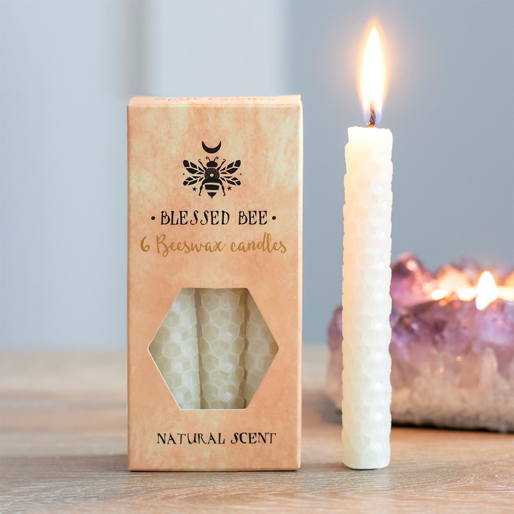 A box of 6 cream Blessed Bee beeswax candles useful for spell-work involving moon magic and luxury. Candle magic is one of the easiest forms of spell casting in which the caster decides on a goal, while visualising the end result and focuses intent or will to manifest that result.
