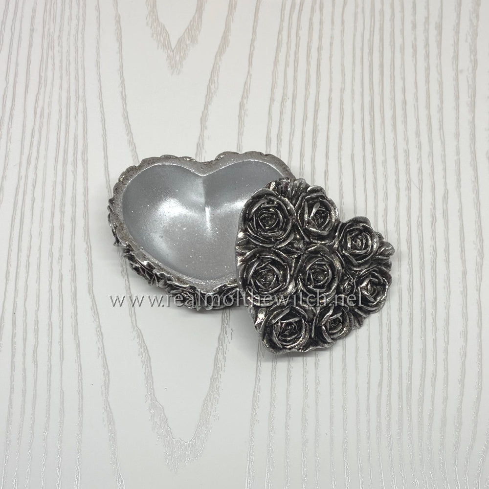 Rose Heart Box with an antique silver effect finish resin trinket box, heart shaped with rose decoration. The same design is also available in black on the website