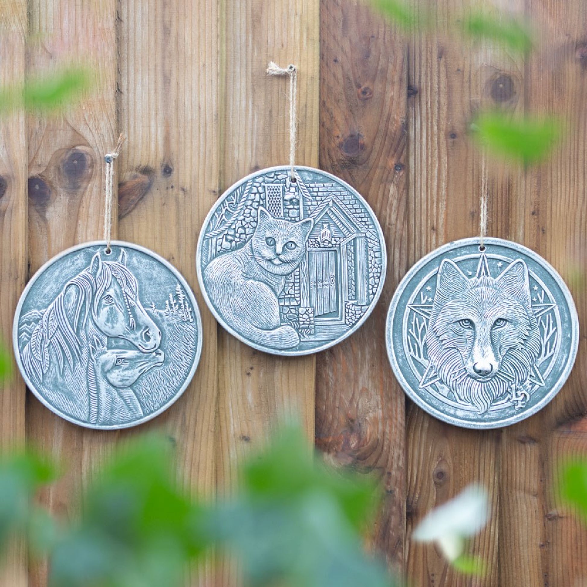 This stunning 20cm terracotta plaque features an enchanting wolf design by Lisa Parker.  This item comes with a twine loop attached ready for hanging.  The plaque features an antique silver effect finish. This same design is also available in bronze effect.  Material: Terracotta Dimensions: H: 20cm x W: 20cm x D: 1cm