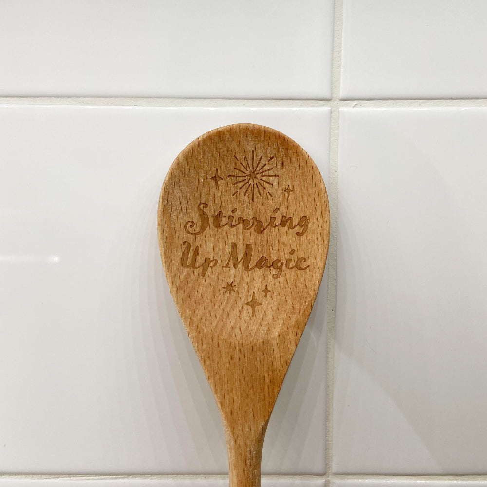 Stir up some magic with this wooden spoon that's a kitchen essential! 'Stirring Up Magic' is carefully etched by hand using pyrography onto the front and makes this staple a bit more special. Use it for concocting spells, potions and bakes or as a decorative item on your kitchen wall.   Dimensions: H: 30cm x W: 6.5cm x D: 1.2cm
