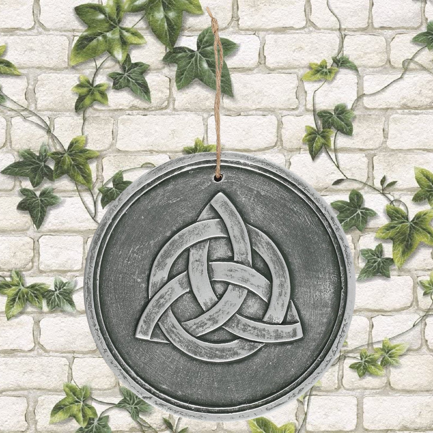 A stunning terracotta wall plaque available in silver effect and striking triquetra design. Also known as a trinity knot, this symbol is commonly used to represent unity. Like many knots, it can be seen as a Celtic symbol for strength. Perfect for garden decoration or indoors! Also available in copper effect Size: H: 20cm x W: 20cm x D: 1.5cm